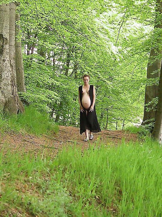 25P Cute pregger taking a walk in the forest