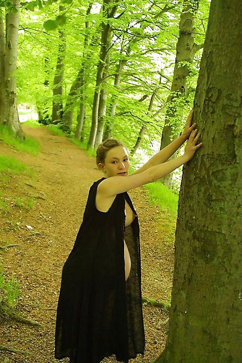 25P Cute pregger taking a walk in the forest