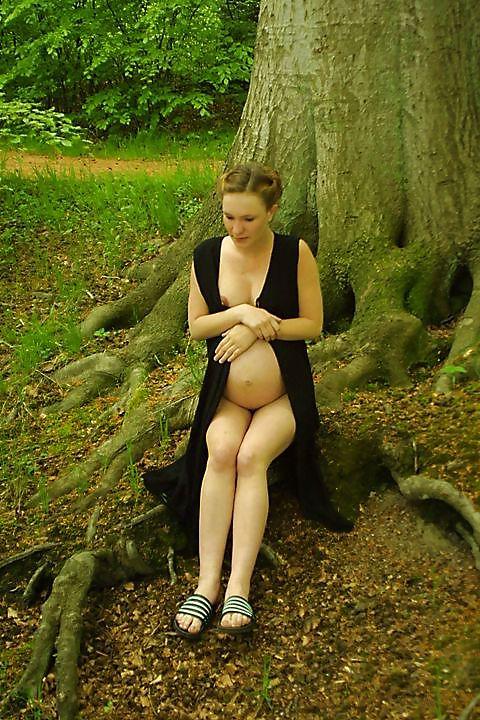 25P Cute pregger taking a walk in the forest