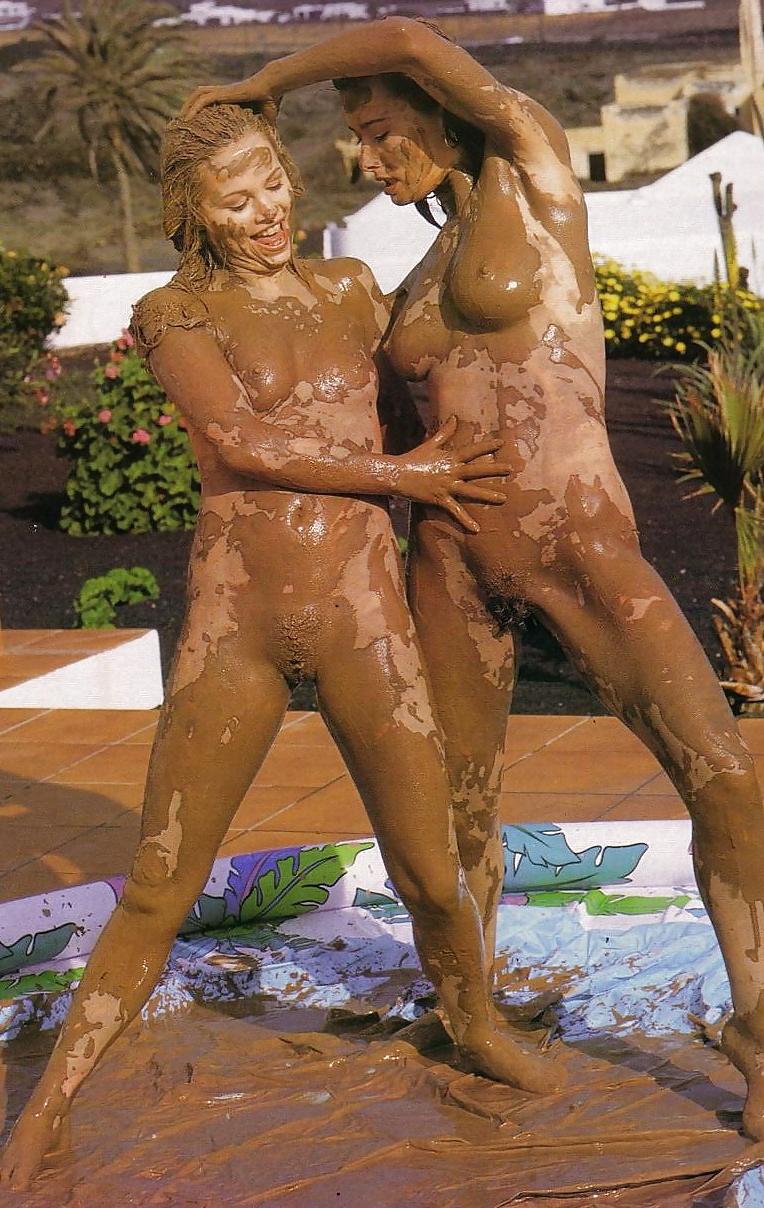 12P Mud fight.  Two babes wrestle.
