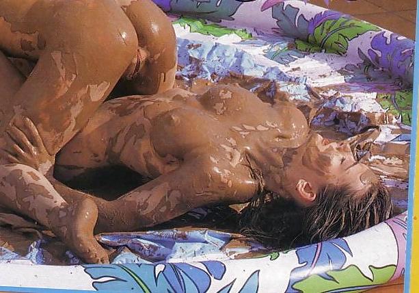 12P Mud fight.  Two babes wrestle.