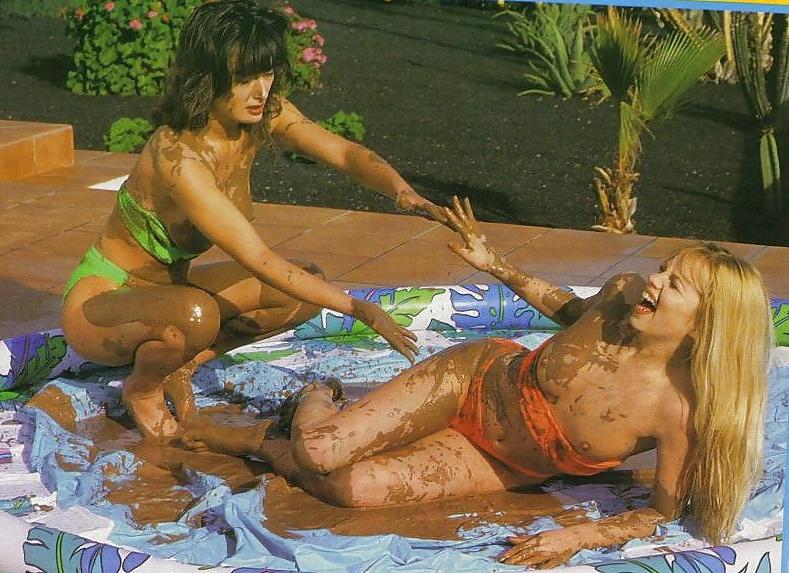 12P Mud fight.  Two babes wrestle.