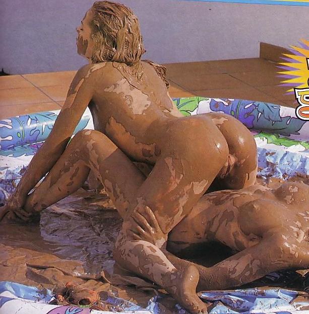 12P Mud fight.  Two babes wrestle.