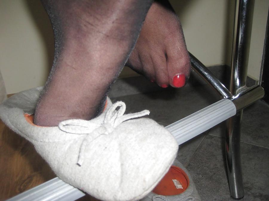 11P Fragrant wife's feet in black tights and slippers