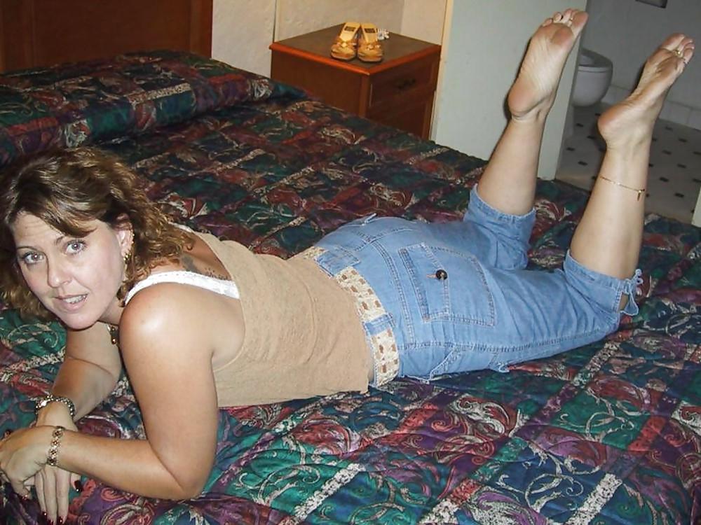 11P Mature TINA shows her hot feet