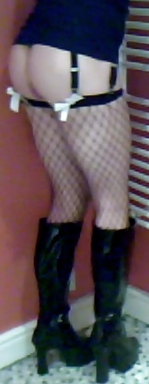 7P Fishnets, pvc boots and black short skirt
