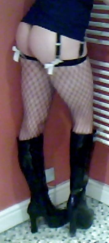 7P Fishnets, pvc boots and black short skirt