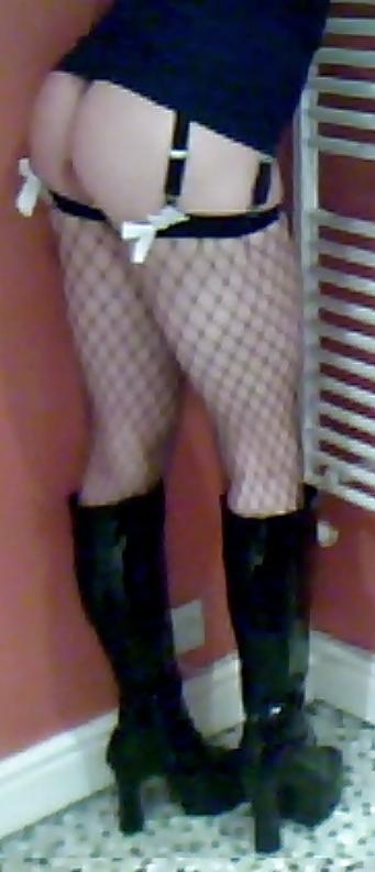 7P Fishnets, pvc boots and black short skirt