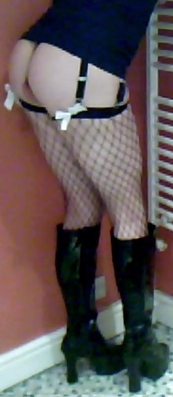 7P Fishnets, pvc boots and black short skirt