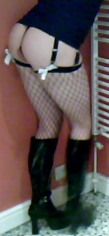 7P Fishnets, pvc boots and black short skirt