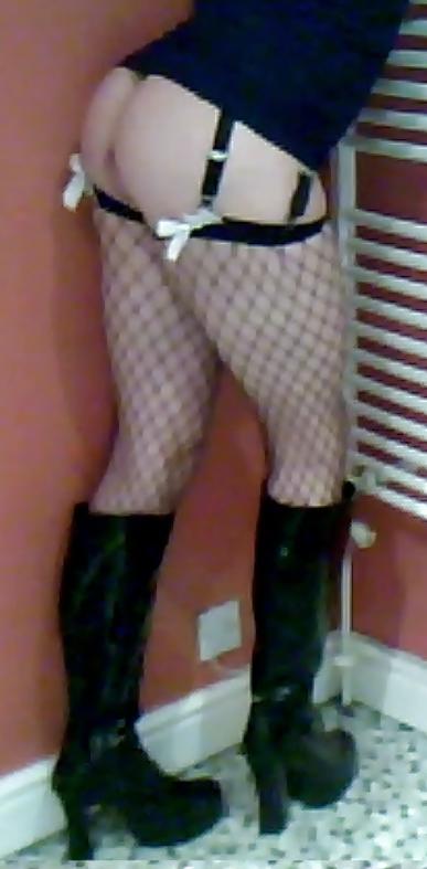 7P Fishnets, pvc boots and black short skirt