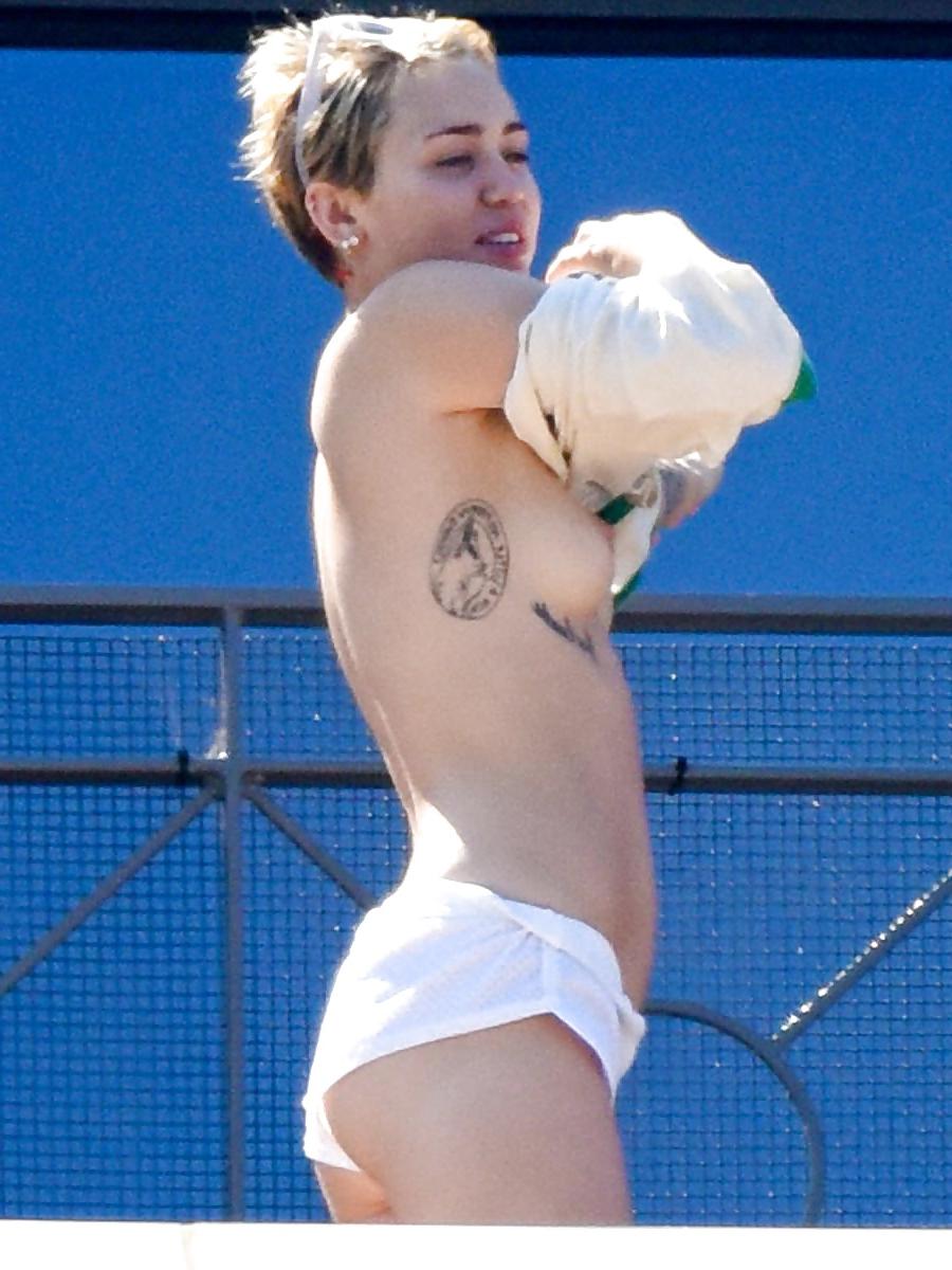 14P Miley Cyrus topless in Australia