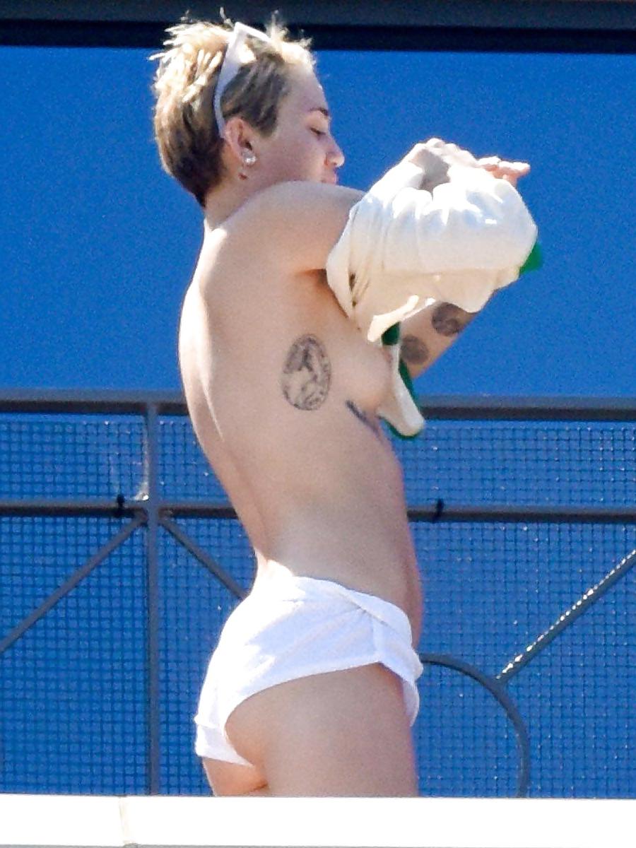 14P Miley Cyrus topless in Australia