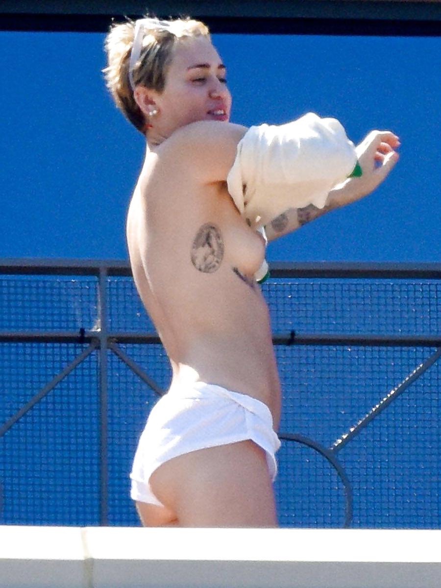 14P Miley Cyrus topless in Australia