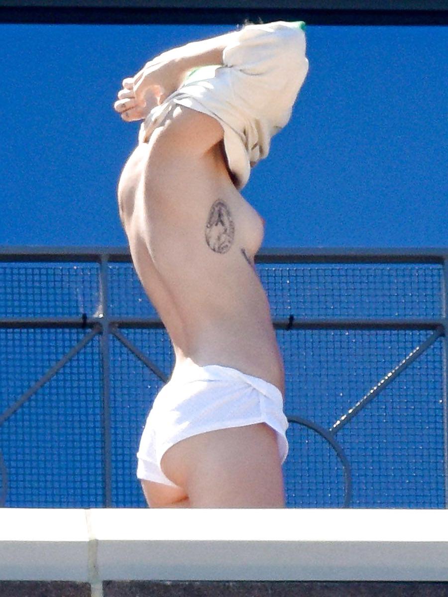 14P Miley Cyrus topless in Australia