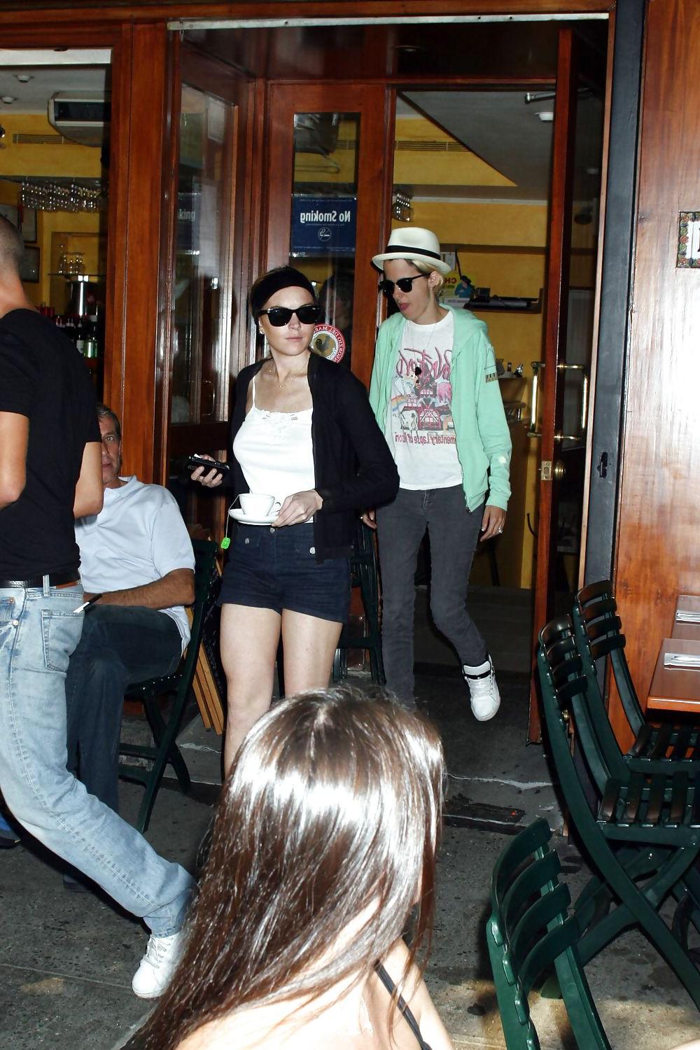 25P Lindsay Lohan is leggy smoking a cigarette in denim shorts