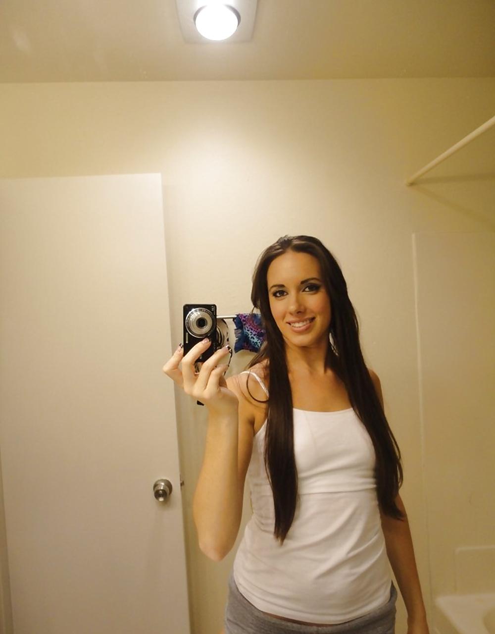 14P Young bitch in white shirt posing in the mirror