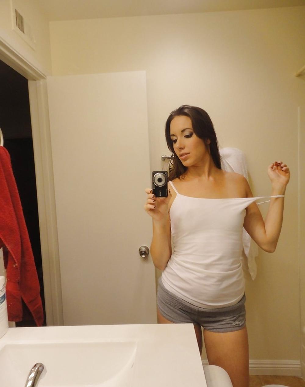 14P Young bitch in white shirt posing in the mirror