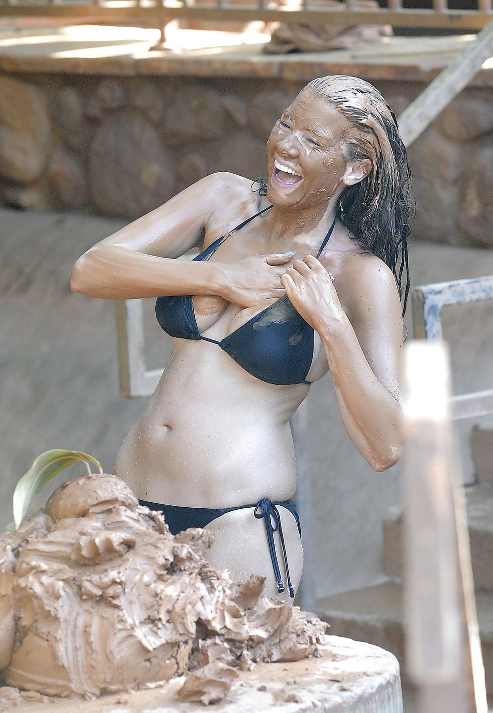 25P Imogen Thomas in a bikini having some fun in the pool mud