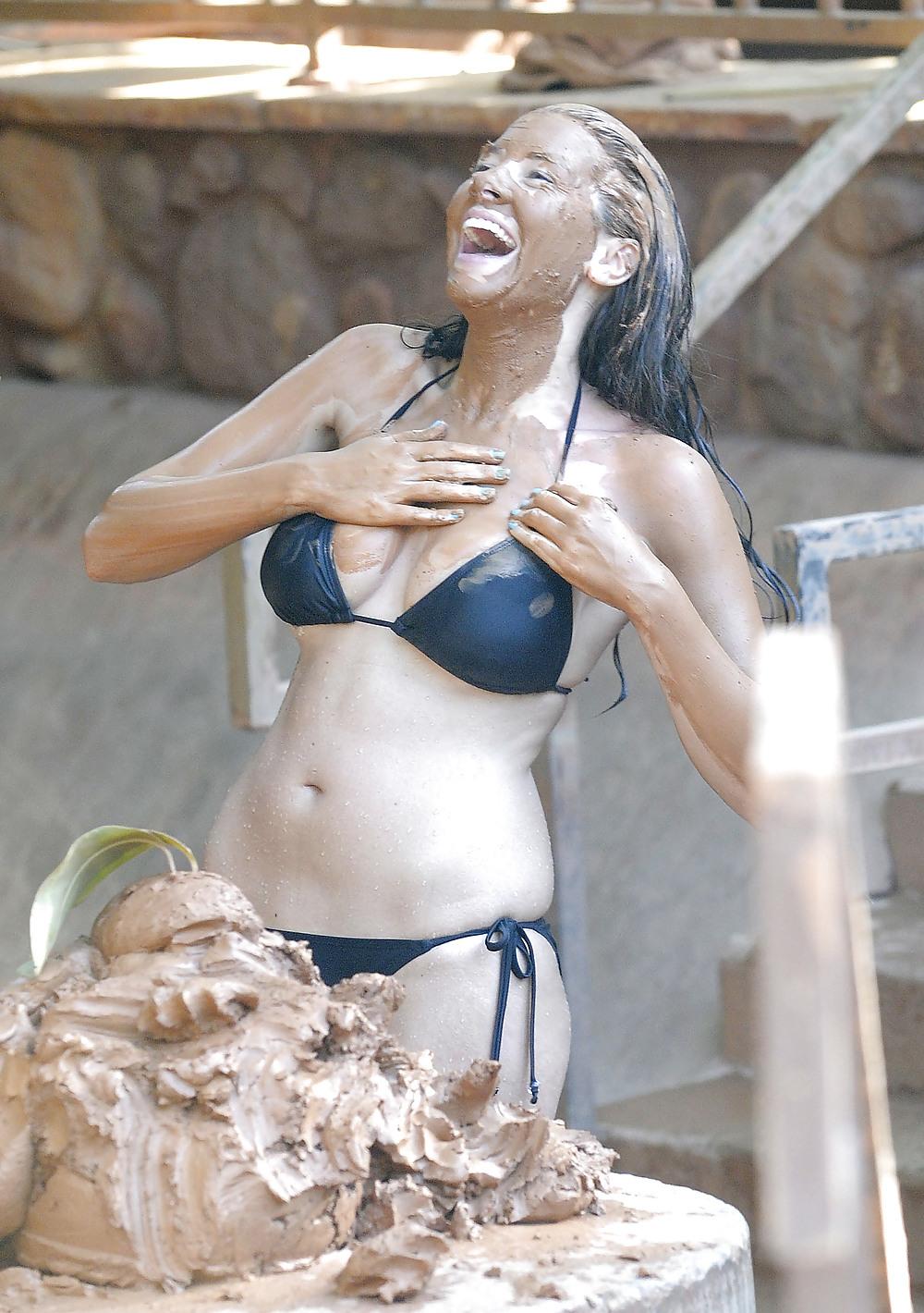 25P Imogen Thomas in a bikini having some fun in the pool mud
