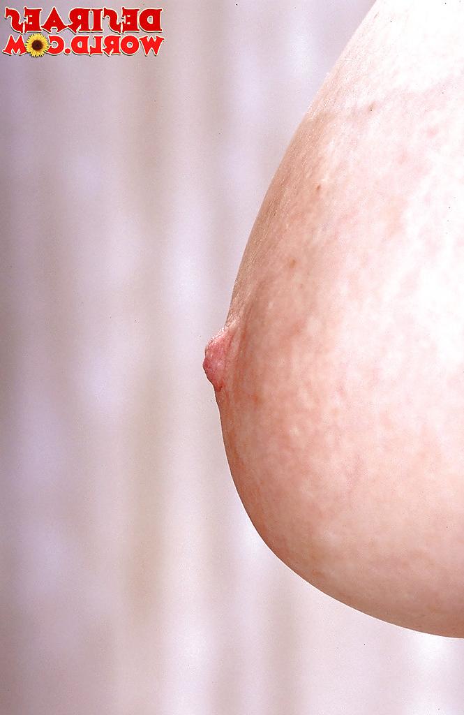 16P Pantyhose adorned MILF pornstar frees huge hooters for nipple play