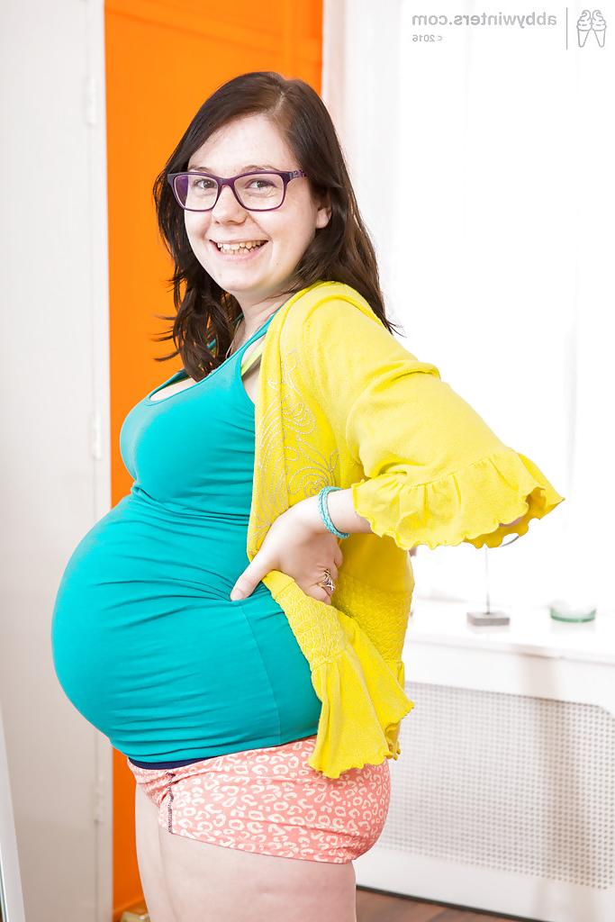 16P Glasses wearing amateur pregnant solo girl revealing baby bump and breasts