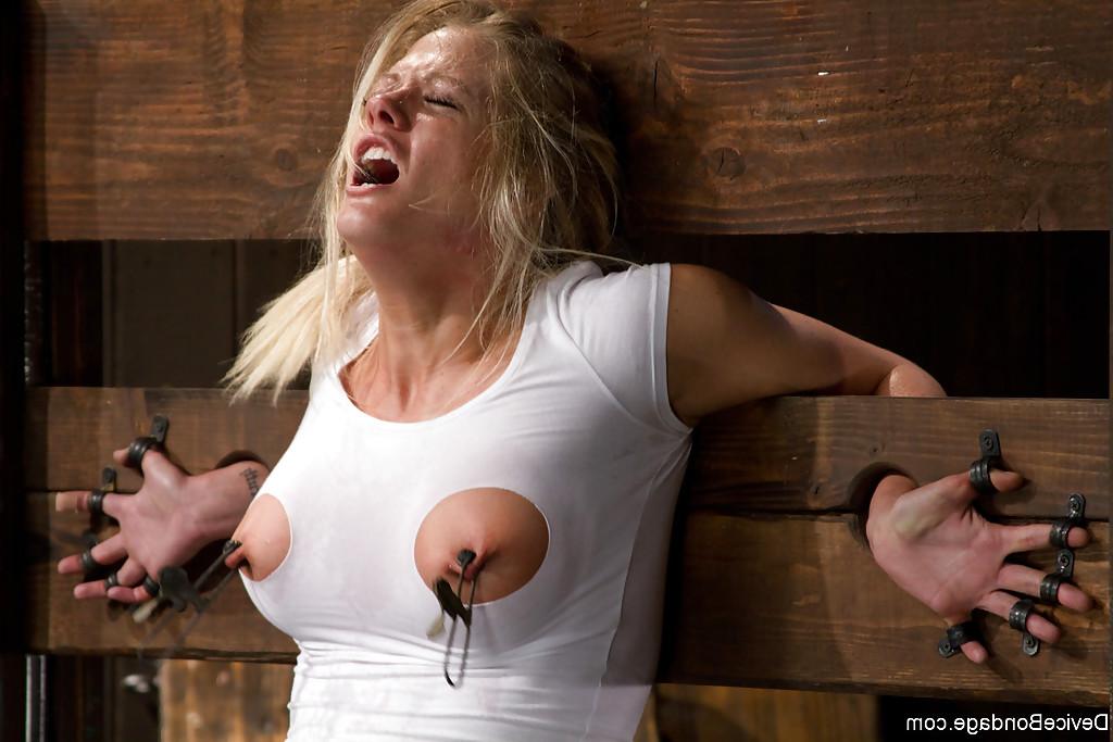13P Busty blonde Holly Heart having pink tongue clothes pinned up close