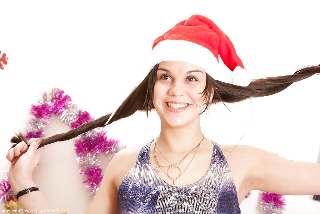 16P Santa's little helper, babe Evelyn strips for hairy pussy solo play