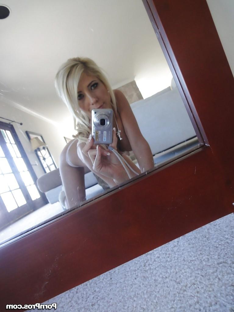 16P Blonde female Tasha Reign taking mirror self shots while removing her clothes