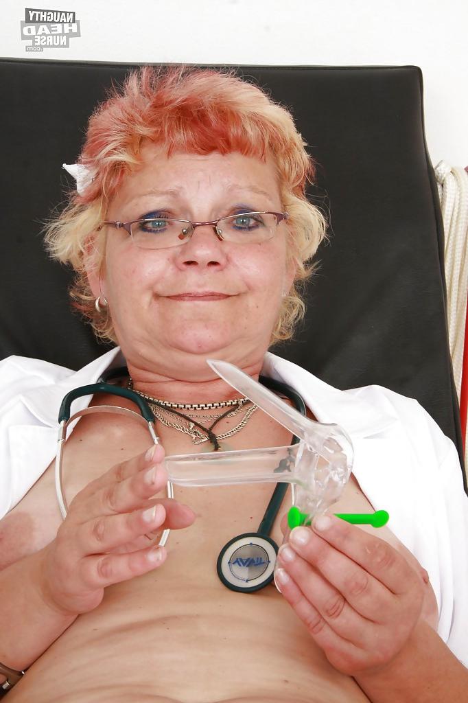 16P Naughty granny in stockings stuffing her twat by a toy and gyno tools