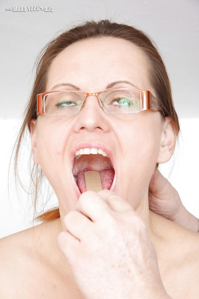 16P Stunning mature lady in glasses gets her bushy twat examed by gyno