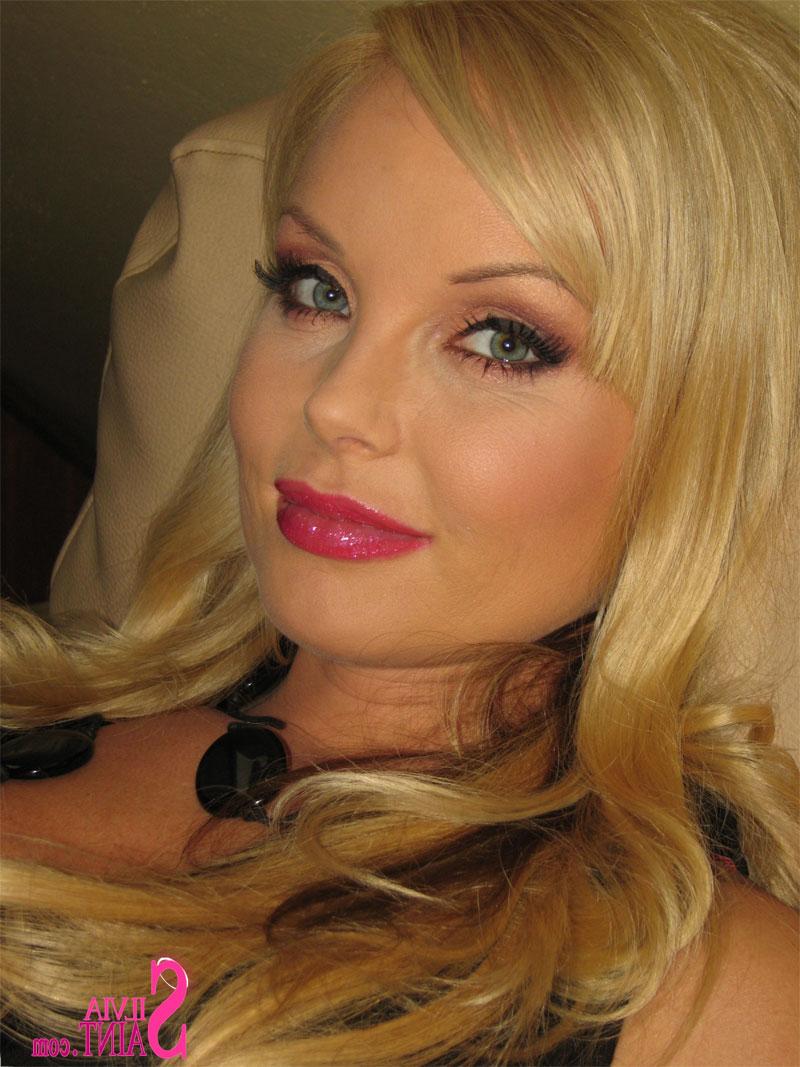 15P Hot blonde cougar Silvia Saint enjoys posing in a sensual manner