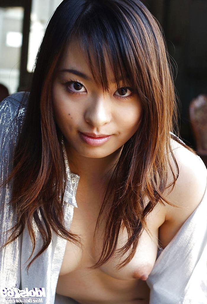16P Petite asian babe Hikaru Koto taking off her shirt and posing topless