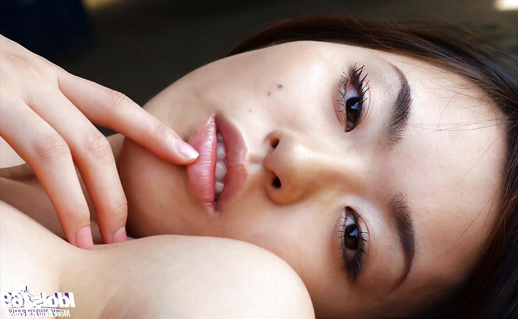 16P Petite asian babe Hikaru Koto taking off her shirt and posing topless