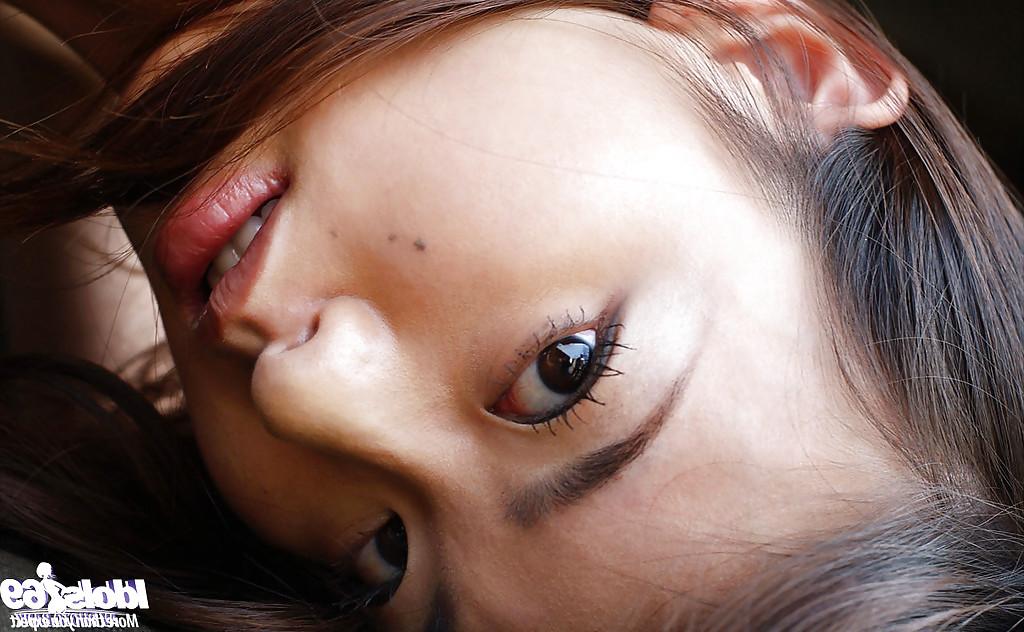 16P Petite asian babe Hikaru Koto taking off her shirt and posing topless
