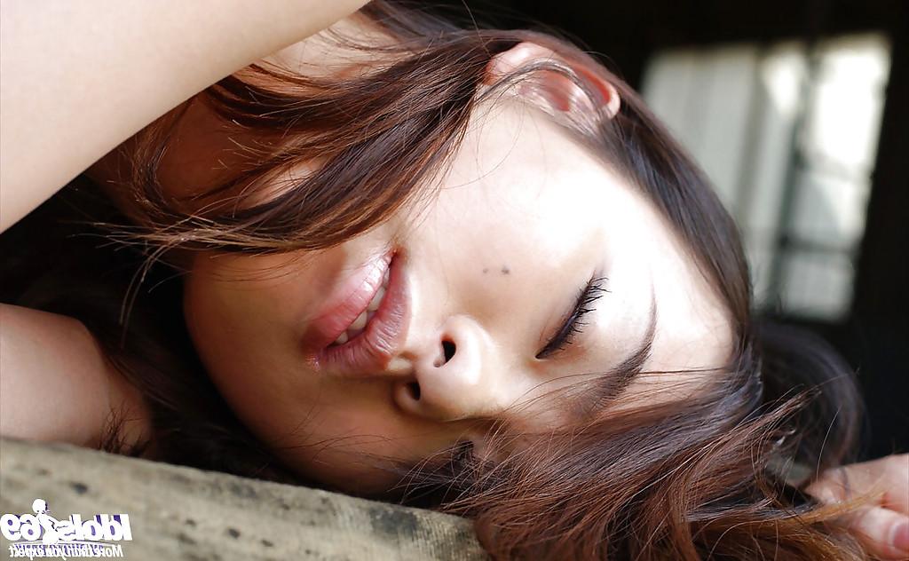 16P Petite asian babe Hikaru Koto taking off her shirt and posing topless