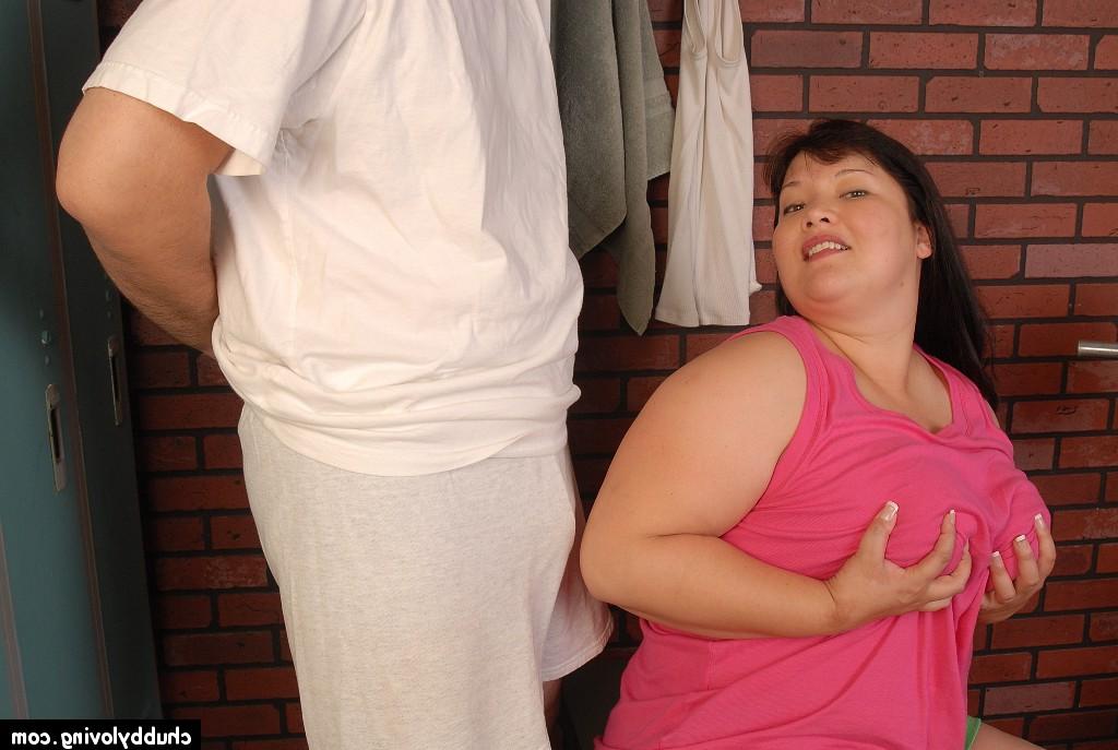 16P Asian fatty Olivia strips off shirt to reveal big all natural breasts