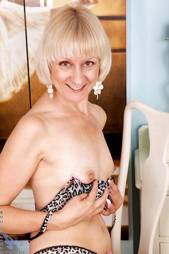 15P Sexy mature lady with tiny tits stripping and exposing her hairy twat