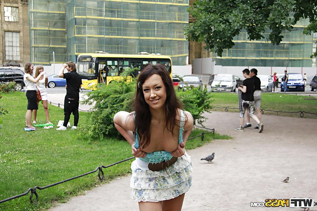16P Foxy brunette babe in miniskirt flashing her tits in public place
