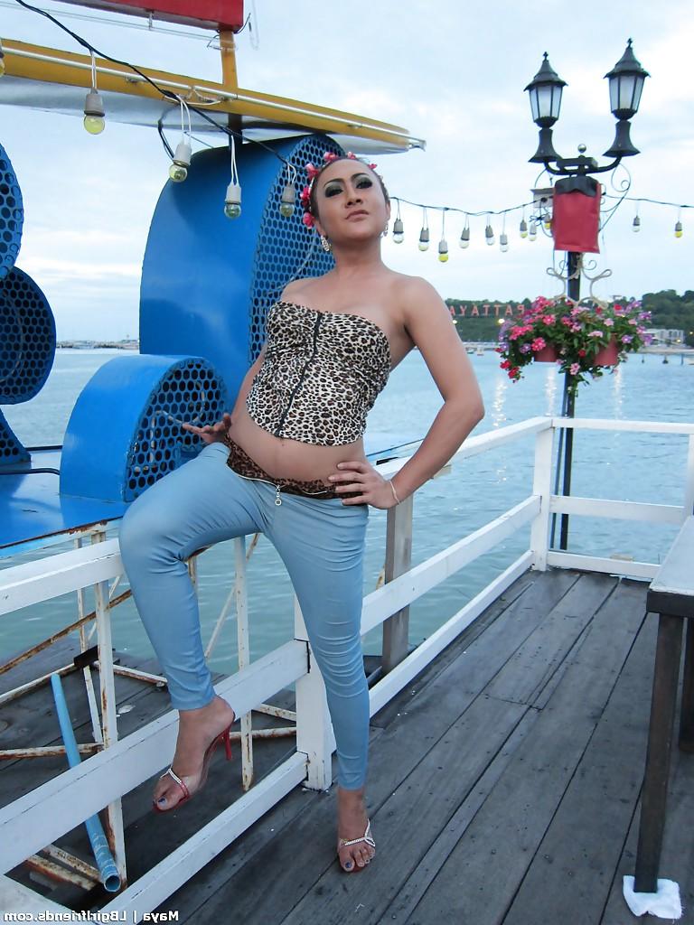 16P Big tit Asian tranny spreading her nasty ass and posing outdoors