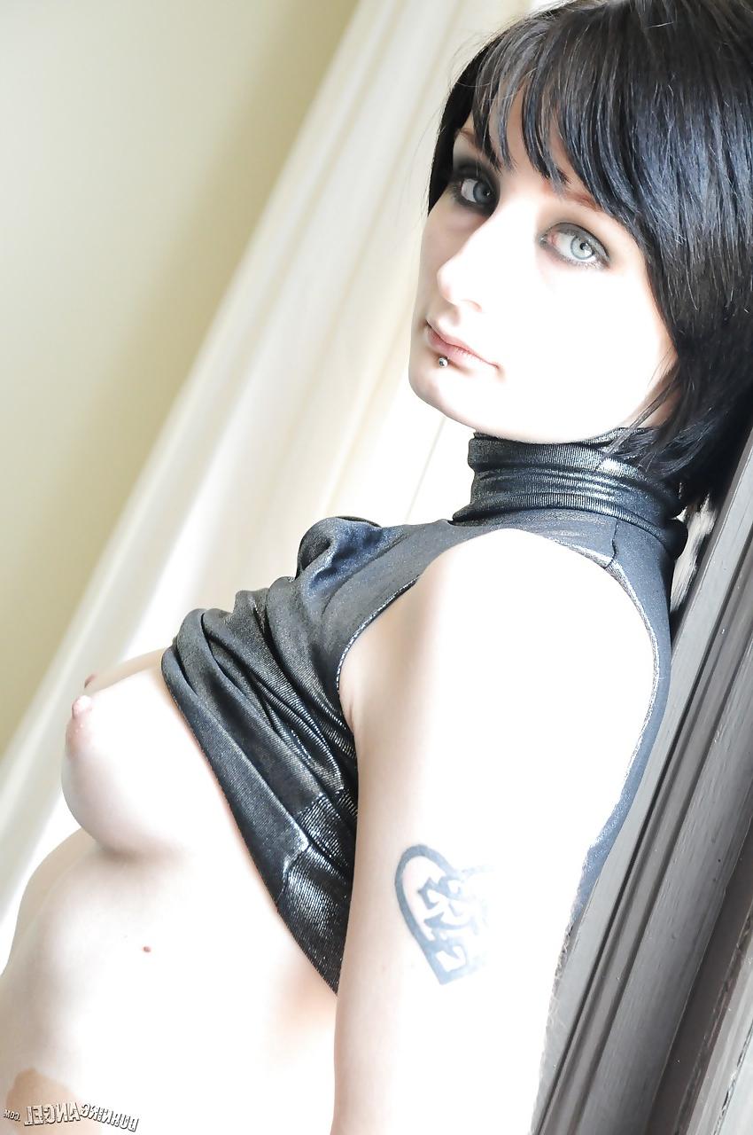 15P Tattooed brunette Violet Monroe smoking cigarette while flashing underwear