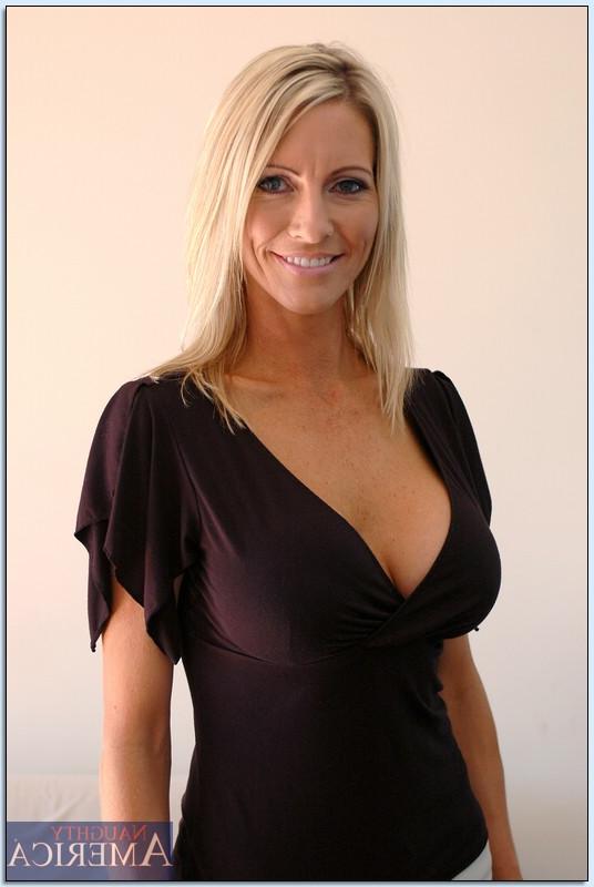 16P Dazzling MILF Emma Starr showing off booming tits and shaved slit