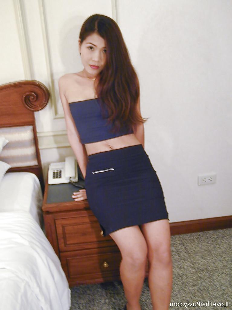 15P Cute asian babe with tiny tits spreading her legs and teasing her muff