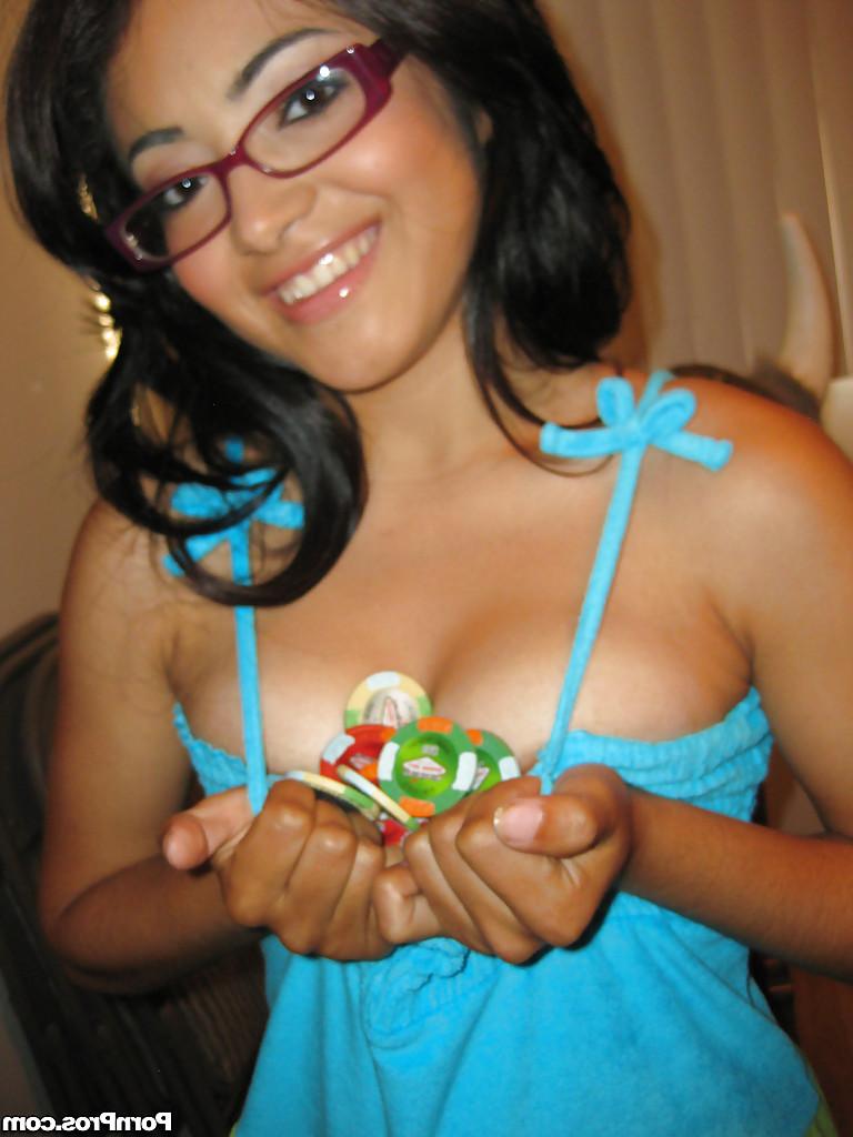 15P Latina babe in glasses Andrea Kelly strips to expose her slender body