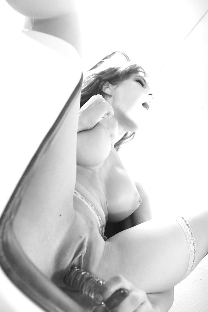 16P Hot babe Capri Cavalli masturbating her juicy cunt in black and white