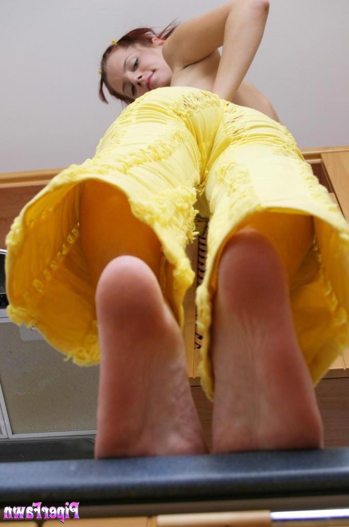 15P Piper Fawn shows off her tits and her feet in the kitchen