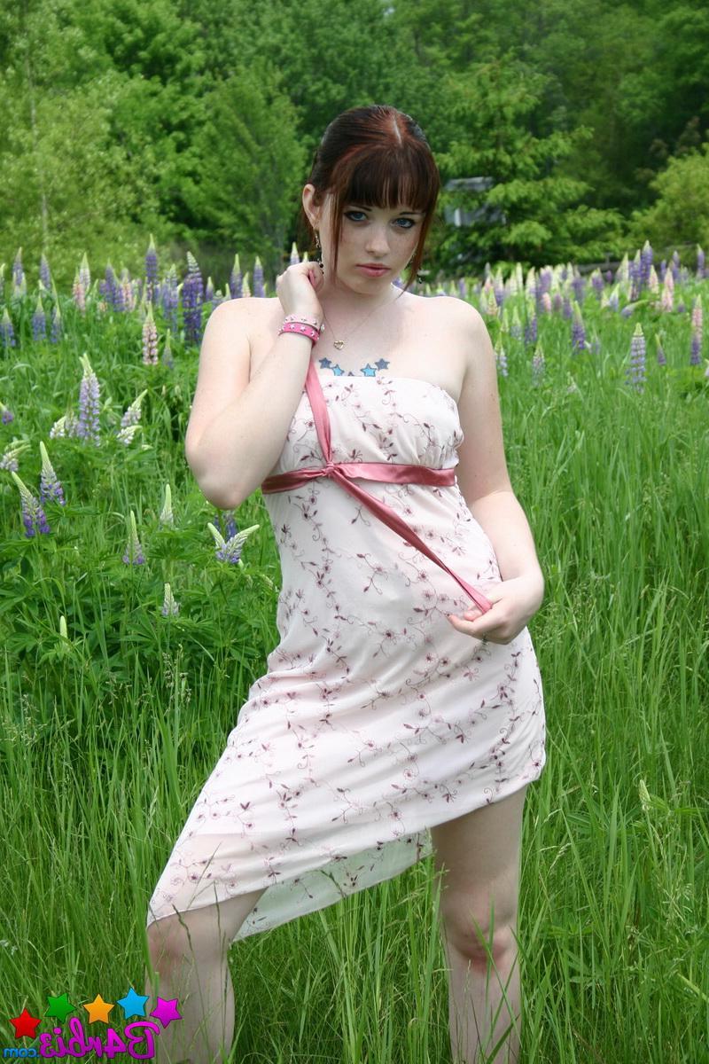 12P Barbie flashes her perfect tits and round ass outdoors in a grass field