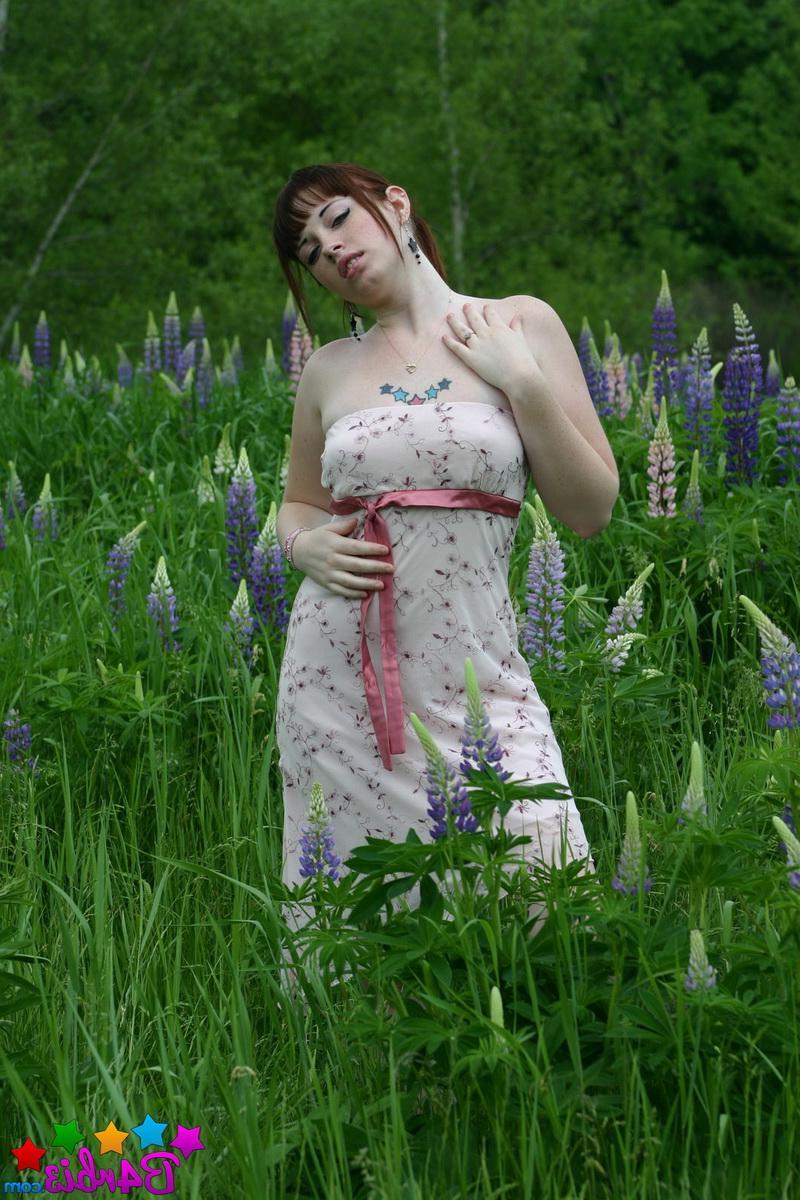 12P Barbie flashes her perfect tits and round ass outdoors in a grass field