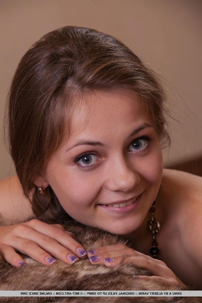 18P Brunette girl Ennu A strips nude and shows her hairy pussy