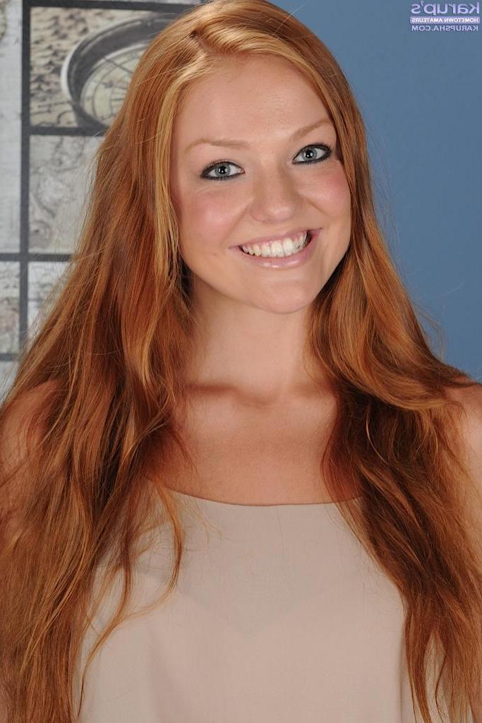 15P Natural redhead Farrah Flower exposes her perky breasts and wet pussy